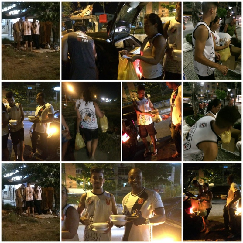 Membros da União Vascaína distribuindo alimentos a moradores de rua